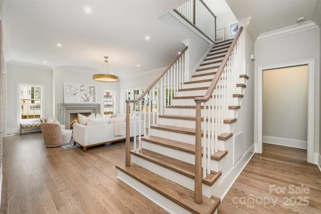 a view of entryway and hall with wooden floor