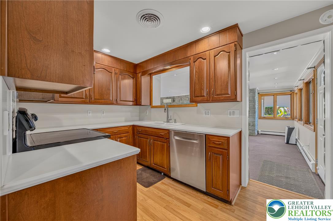 1814 Ruth Street Allentown, PA 18104 - Photo 16 of 54 Rich wood cabinetry paired with light countertops creates a warm, classic culinary space.