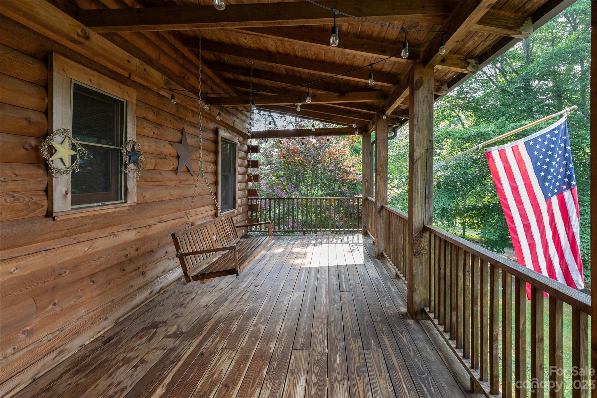 752 Upper Glady Fork Road Candler, NC 28715 - Photo 11 of 38 a view of deck with wooden floor and outdoor seating