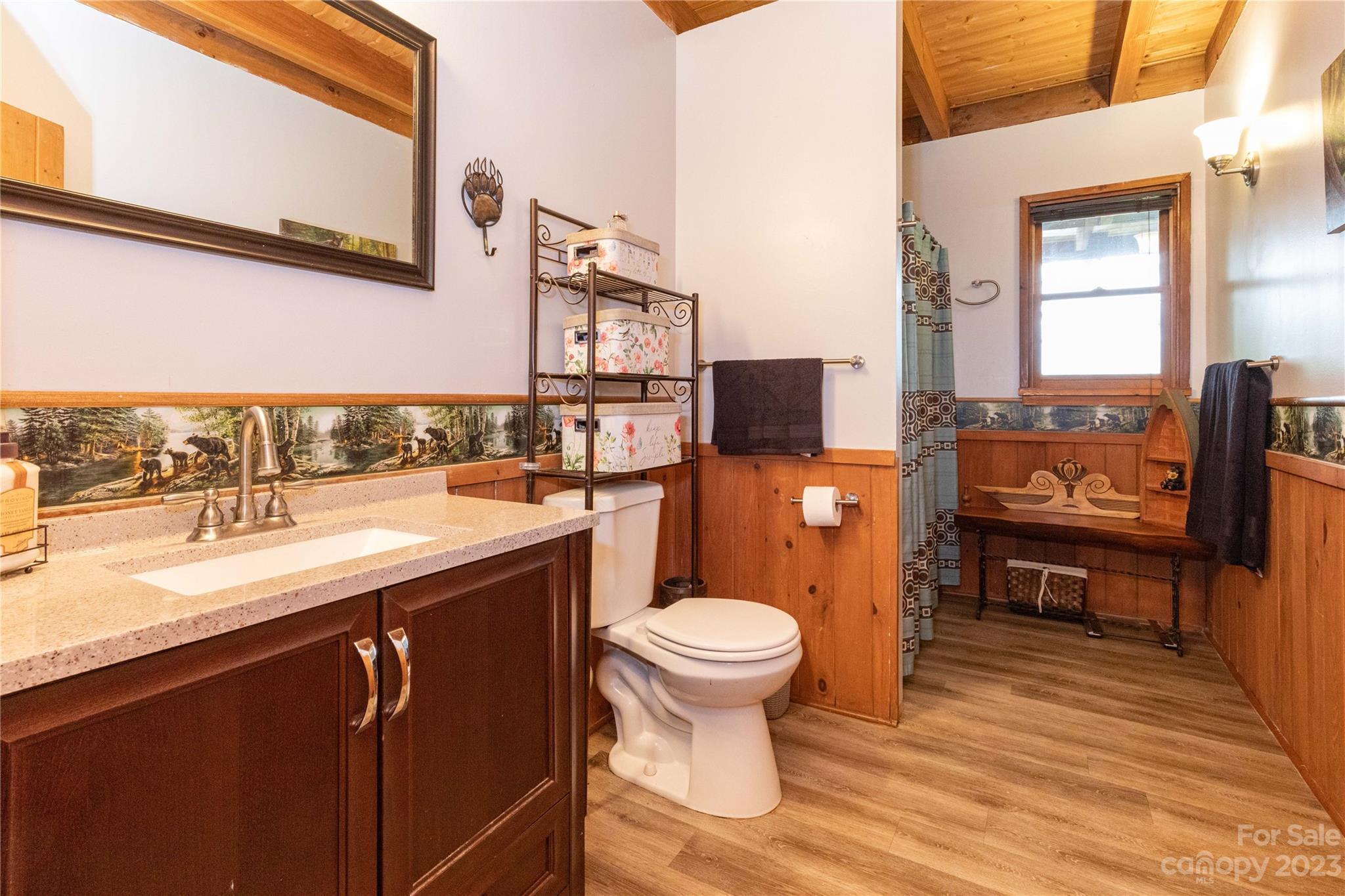 752 Upper Glady Fork Road Candler, NC 28715 - Photo 20 of 38 a bathroom with a sink toilet and mirror