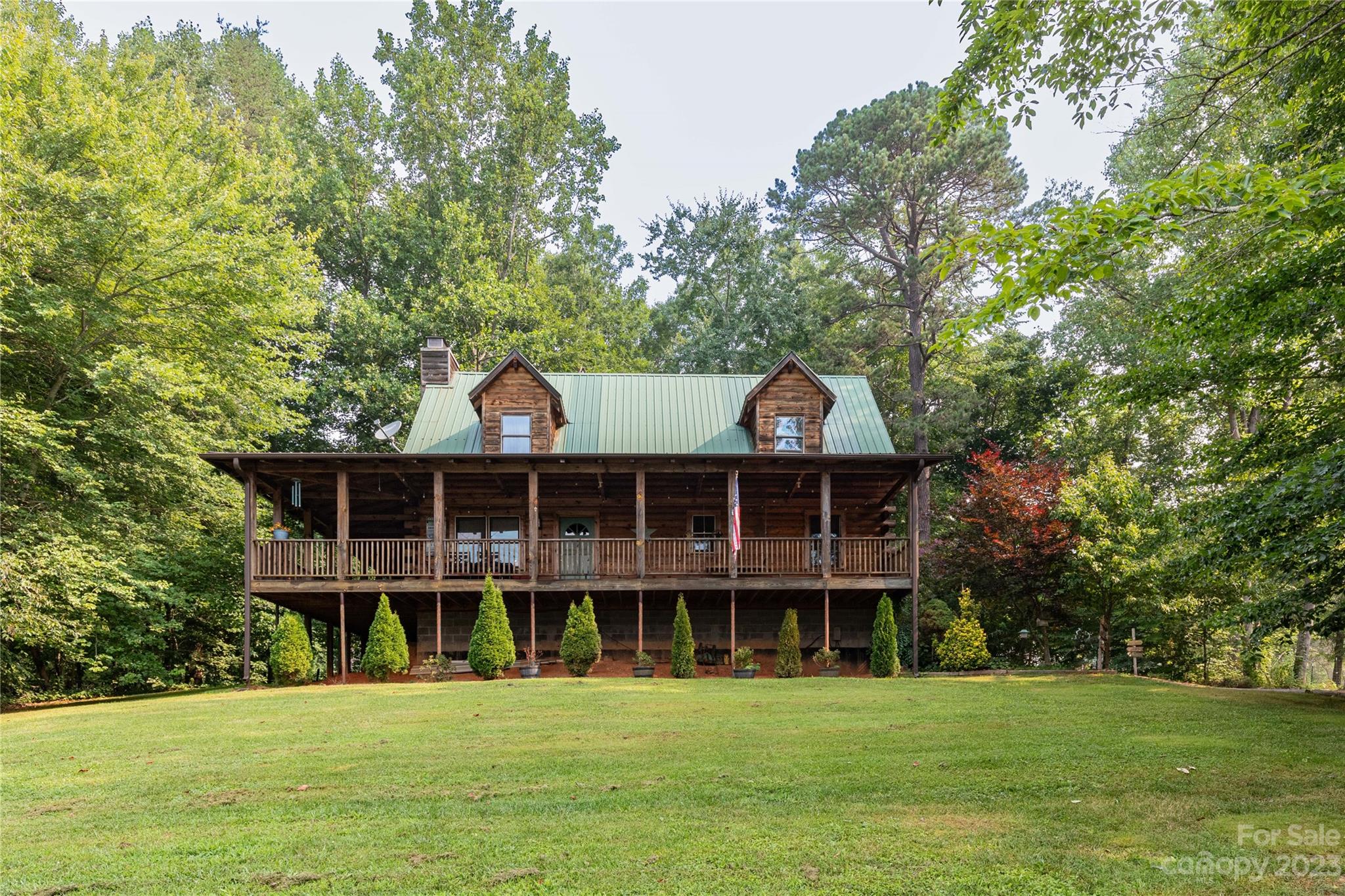 752 Upper Glady Fork Road Candler, NC 28715 - Photo 2 of 38 a view of a house with yard and sitting area