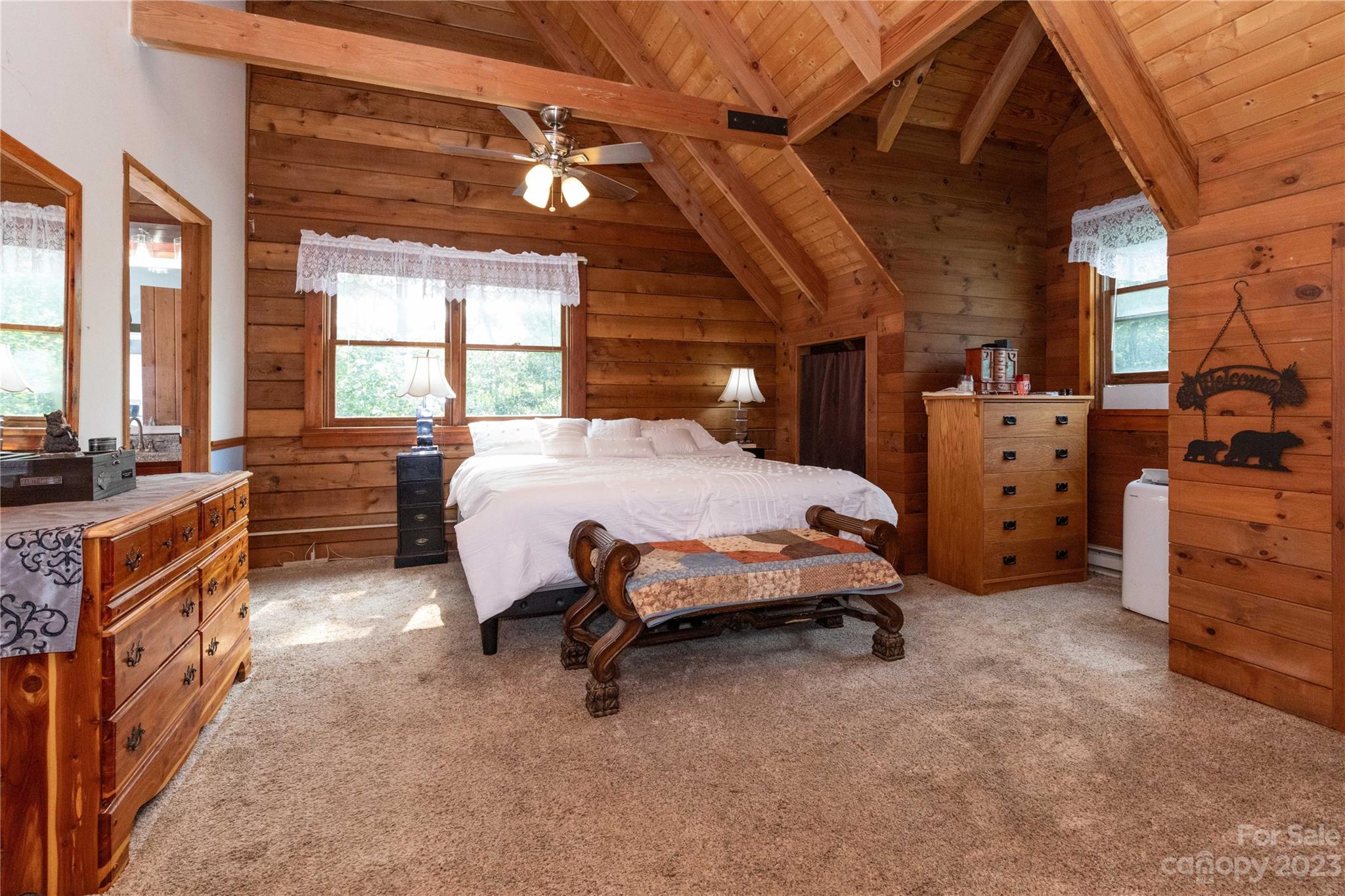752 Upper Glady Fork Road Candler, NC 28715 - Photo 22 of 38 a bedroom with furniture and a large window