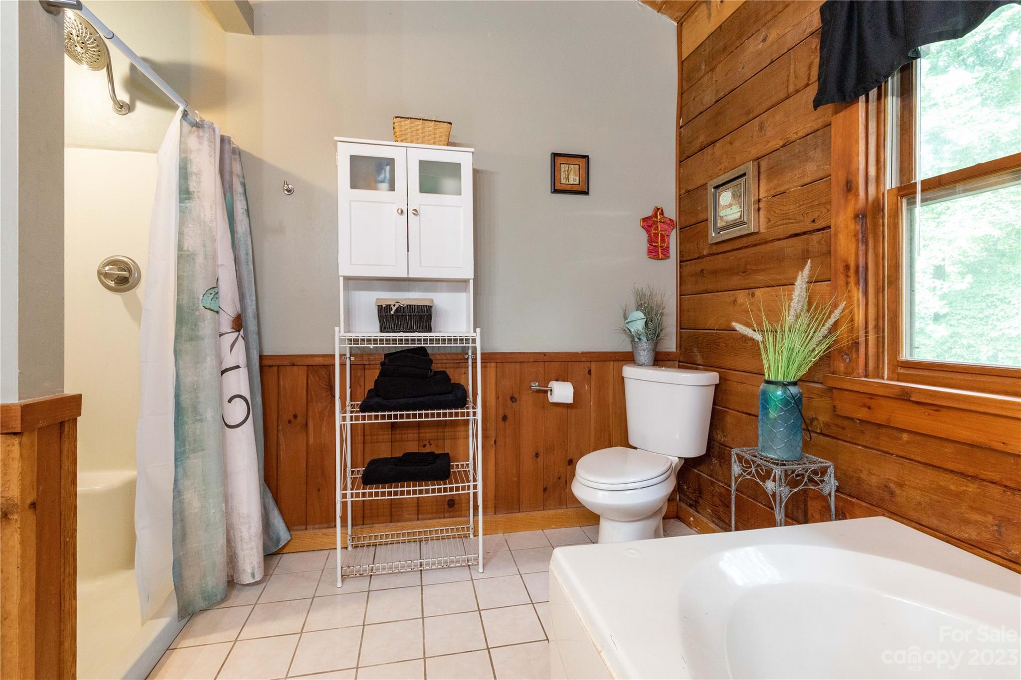 752 Upper Glady Fork Road Candler, NC 28715 - Photo 24 of 38 a bathroom with a sink toilet and shower