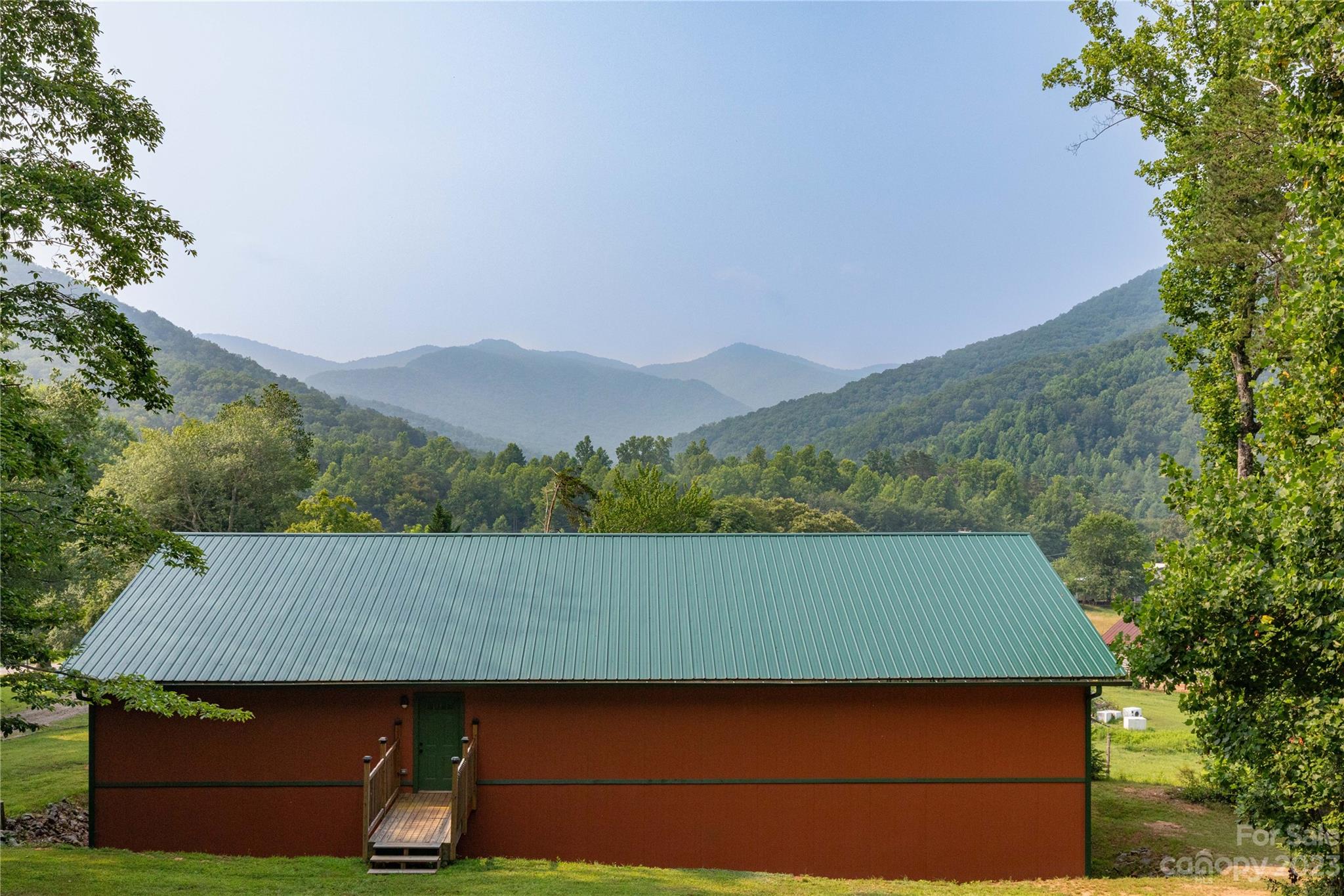 752 Upper Glady Fork Road Candler, NC 28715 - Photo 29 of 38 an aerial view of a house with a yard