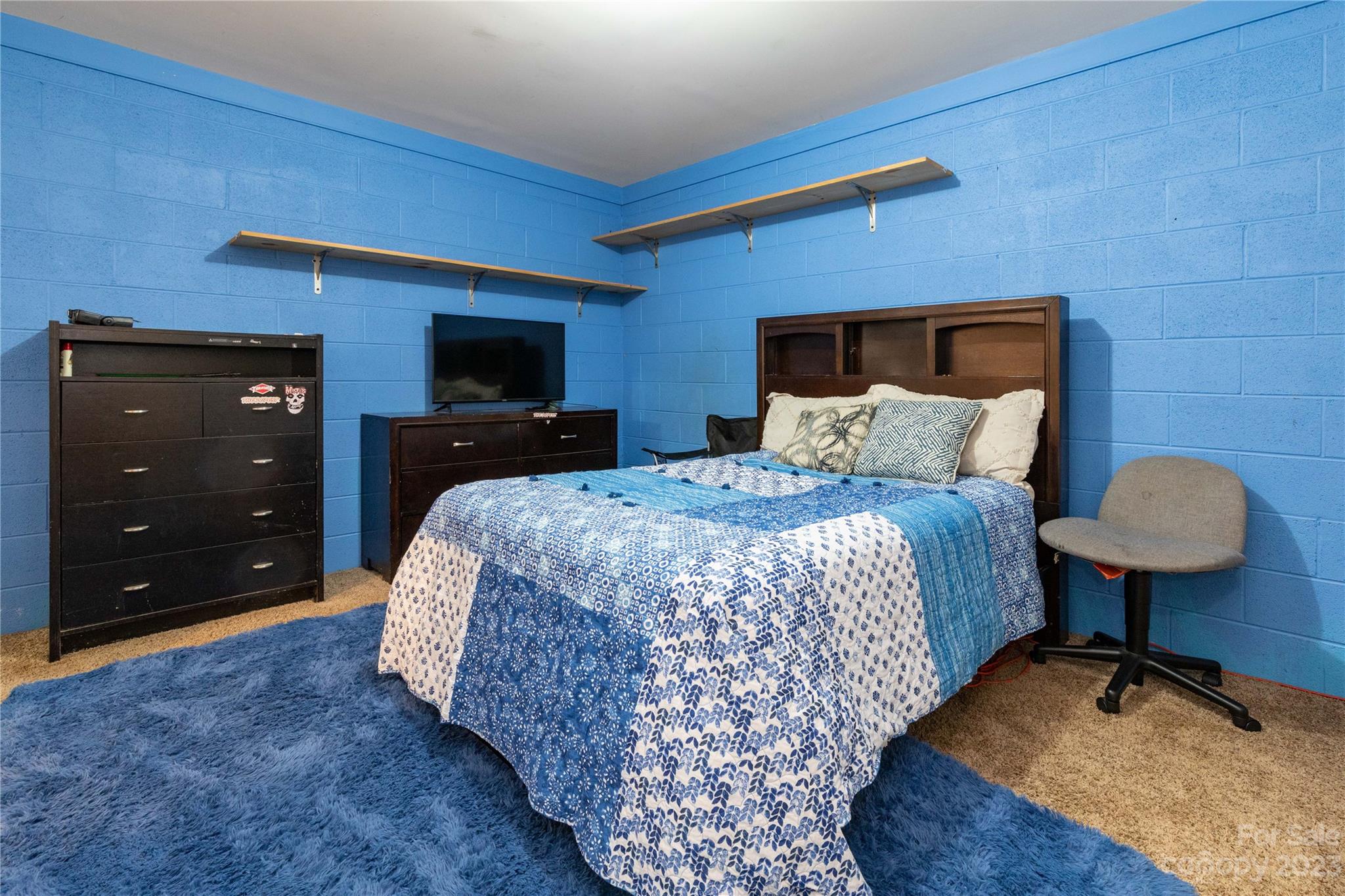 752 Upper Glady Fork Road Candler, NC 28715 - Photo 30 of 38 a bedroom with a bed and a dresser