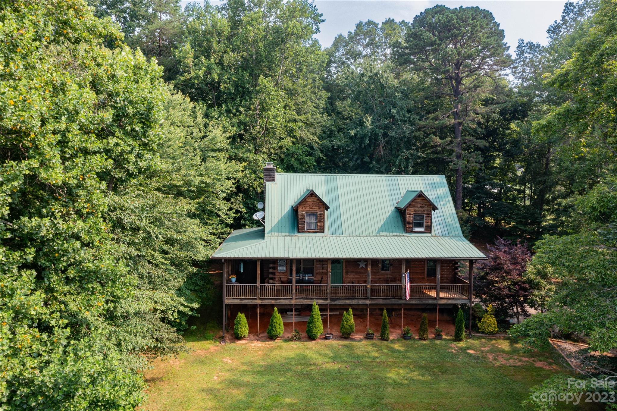 752 Upper Glady Fork Road Candler, NC 28715 - Photo 3 of 38 a view of a house with roof deck and garden