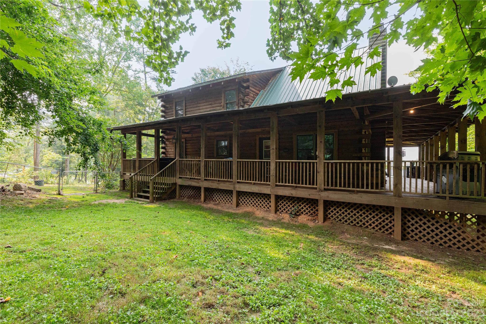 752 Upper Glady Fork Road Candler, NC 28715 - Photo 6 of 38 a view of a house with a yard and wooden fence