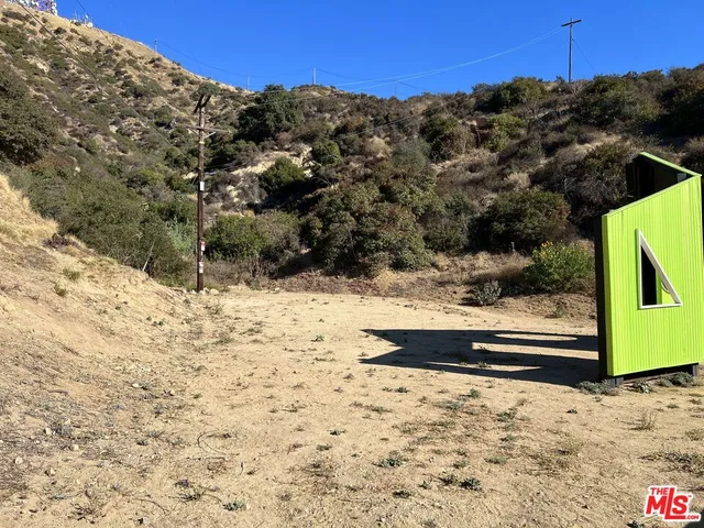 a view of a backyard of the house