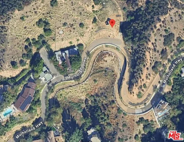 a view of staircase with railing and a rug