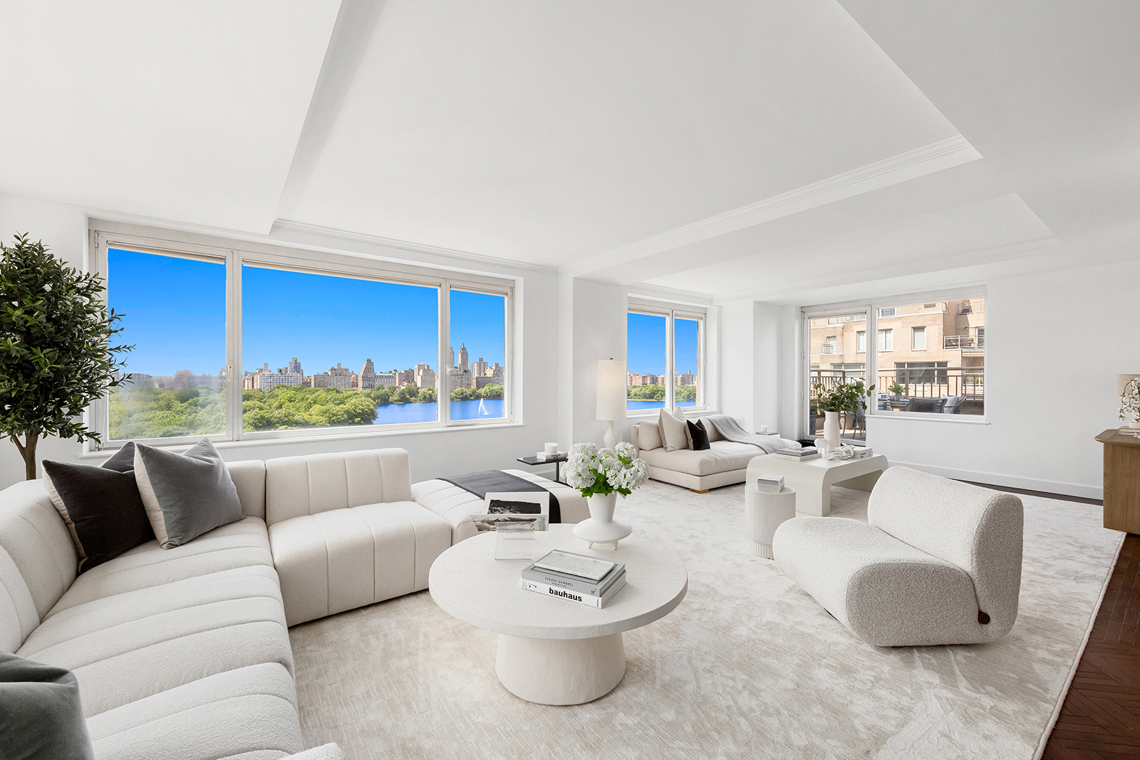 1049 5th Avenue, Unit 17B Manhattan, NY 10028 - Photo 1 of 1 a living room with furniture and a large window