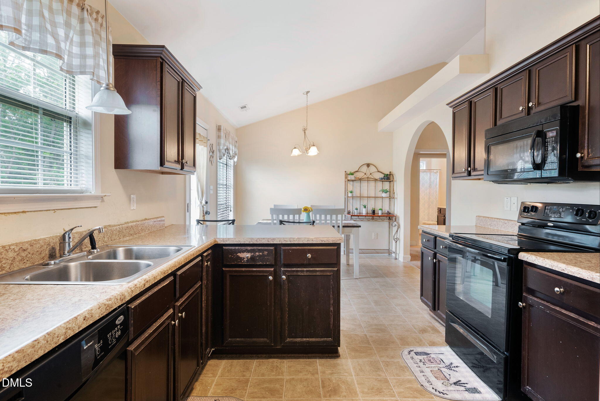 25 Lawrence Court Smithfield, NC 27577 - Photo 13 of 41 a kitchen with stainless steel appliances granite countertop a sink stove and refrigerator