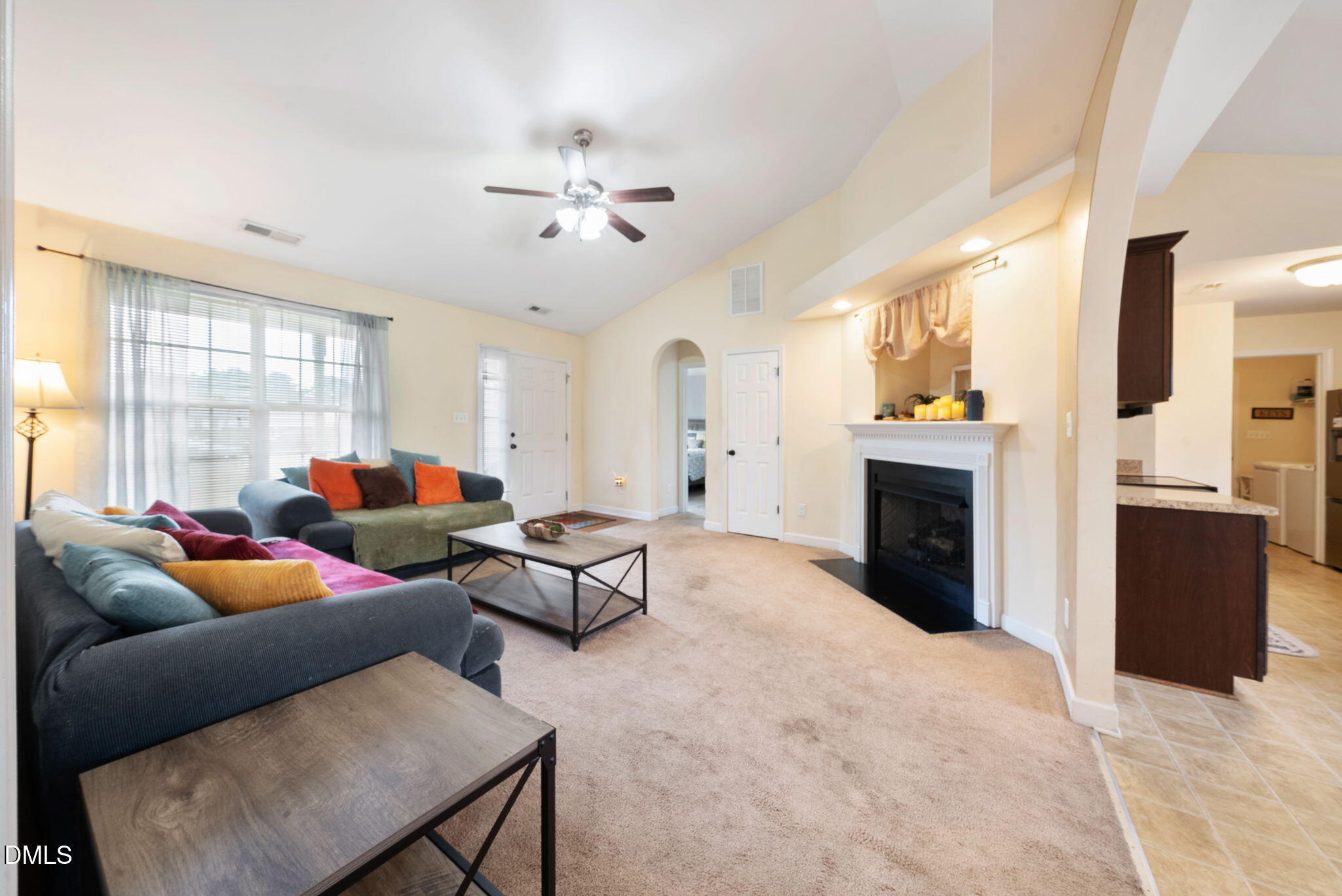 25 Lawrence Court Smithfield, NC 27577 - Photo 20 of 41 a living room with furniture a fireplace and a window
