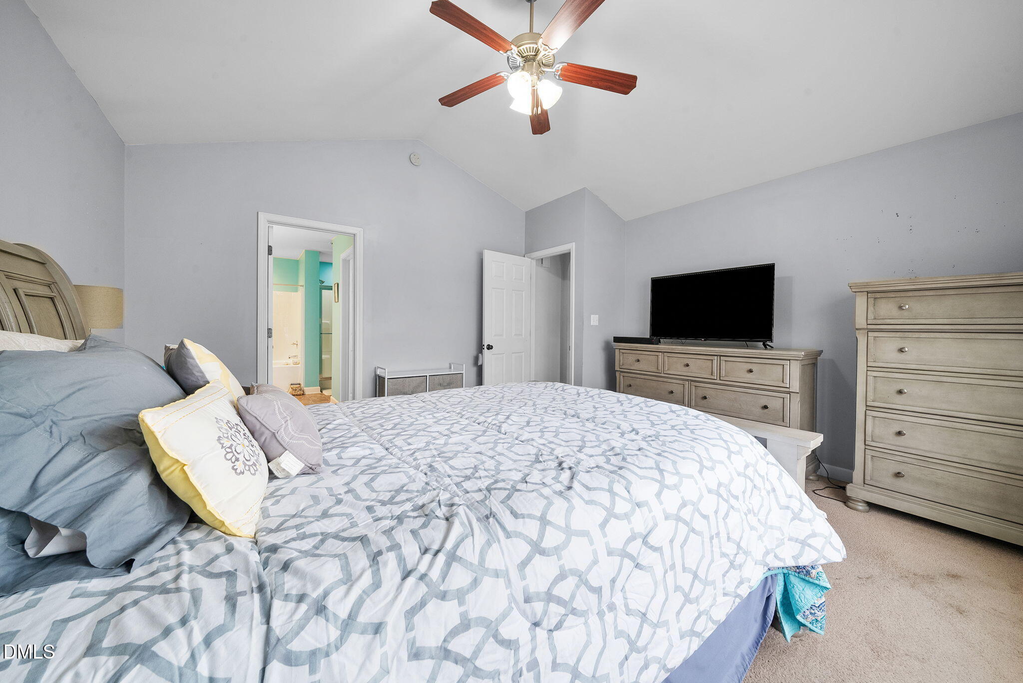 25 Lawrence Court Smithfield, NC 27577 - Photo 27 of 41 a bed room with a bed and a flat screen tv