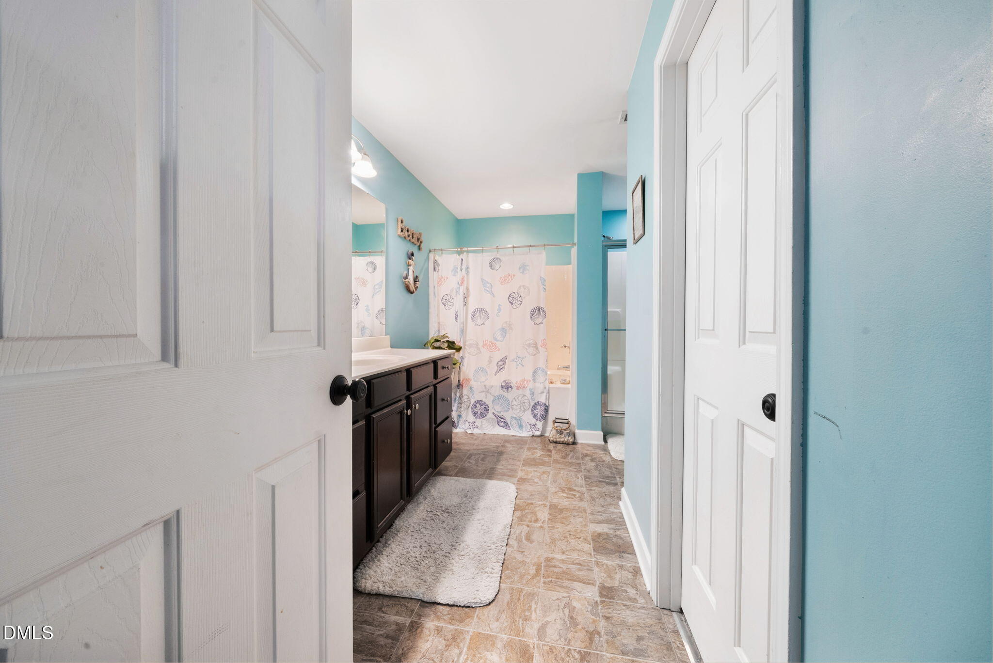 25 Lawrence Court Smithfield, NC 27577 - Photo 30 of 41 a bathroom with a sink and a shower