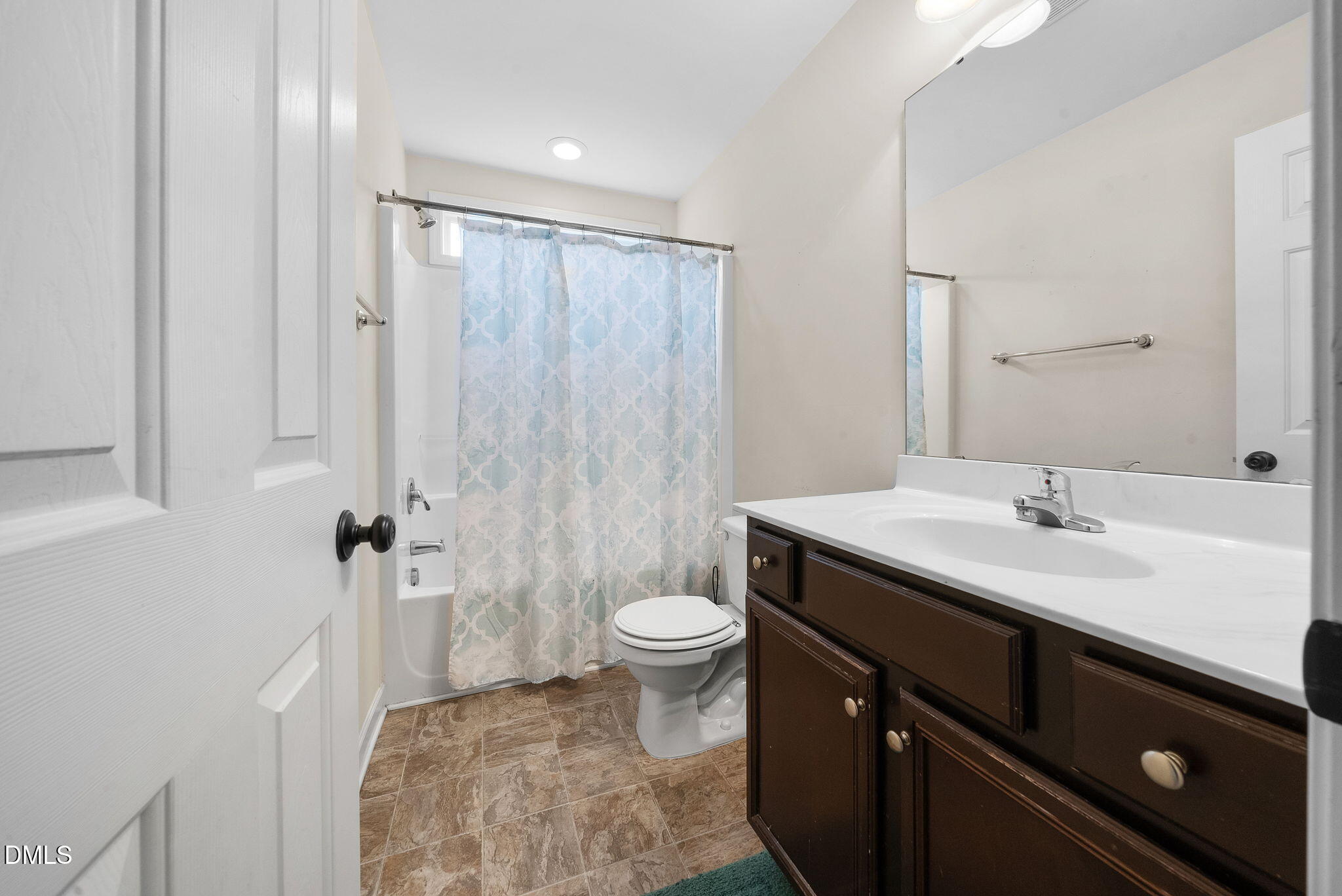 25 Lawrence Court Smithfield, NC 27577 - Photo 34 of 41 a bathroom with a sink a toilet a mirror and shower