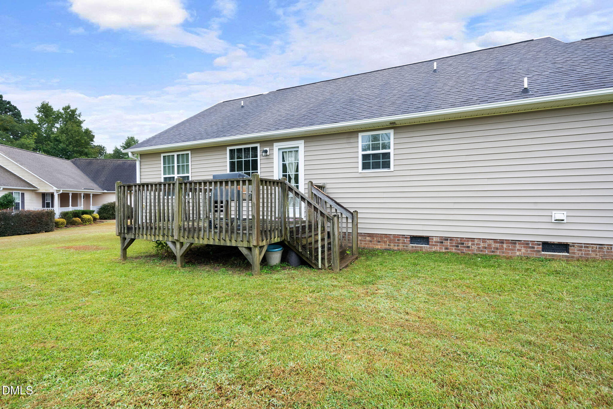 25 Lawrence Court Smithfield, NC 27577 - Photo 40 of 41 a view of a house with a yard and deck