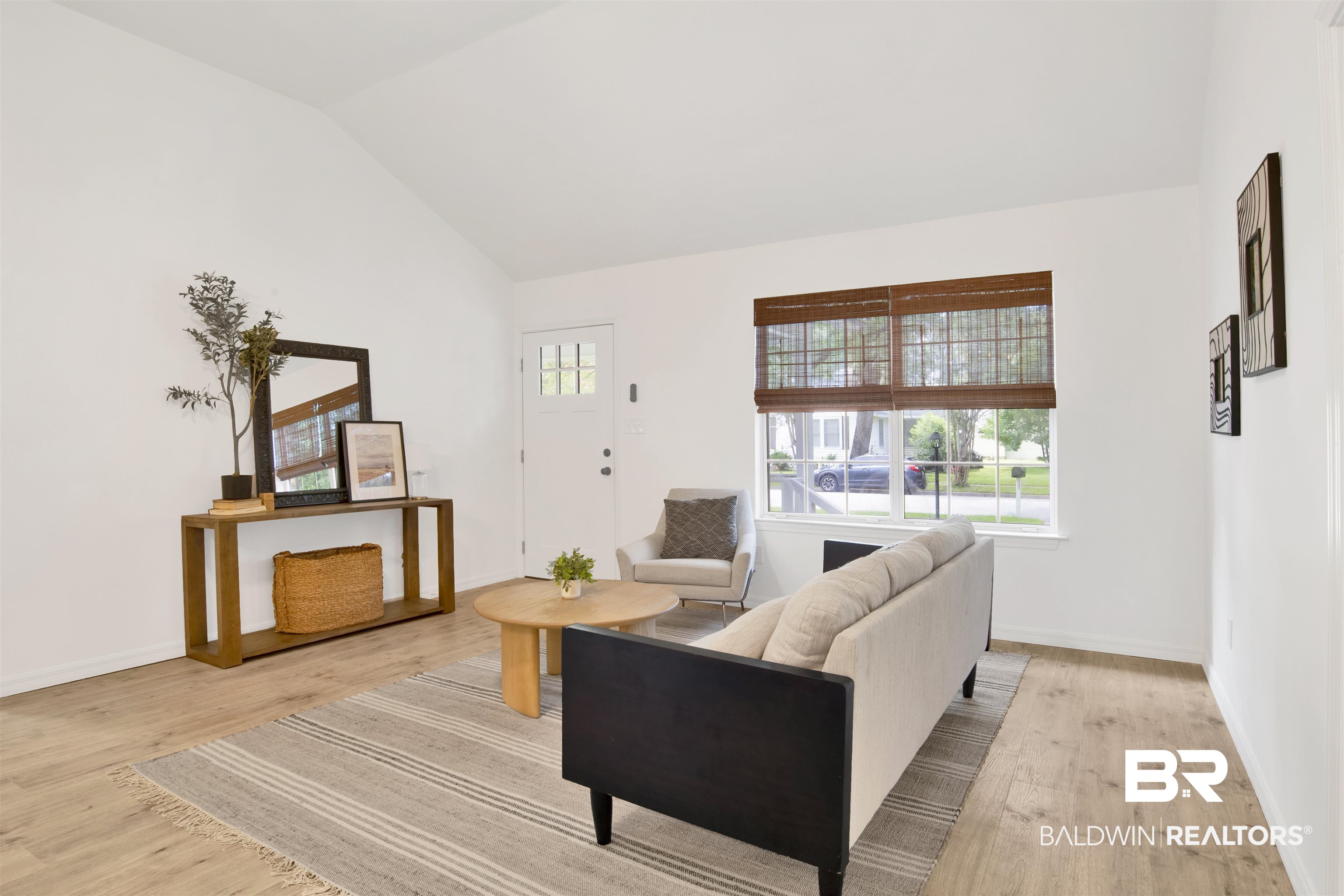 317 Lee Street Chickasaw, AL 36611 - Photo 4 of 40 Living room featuring vaulted ceiling and light wood-type flooring