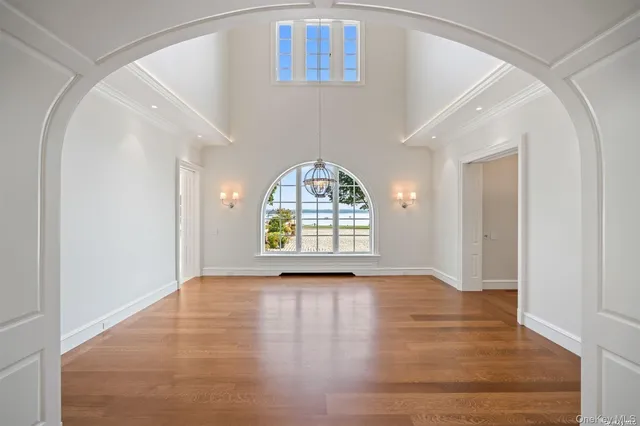 a spacious bedroom with a large bed and a fireplace