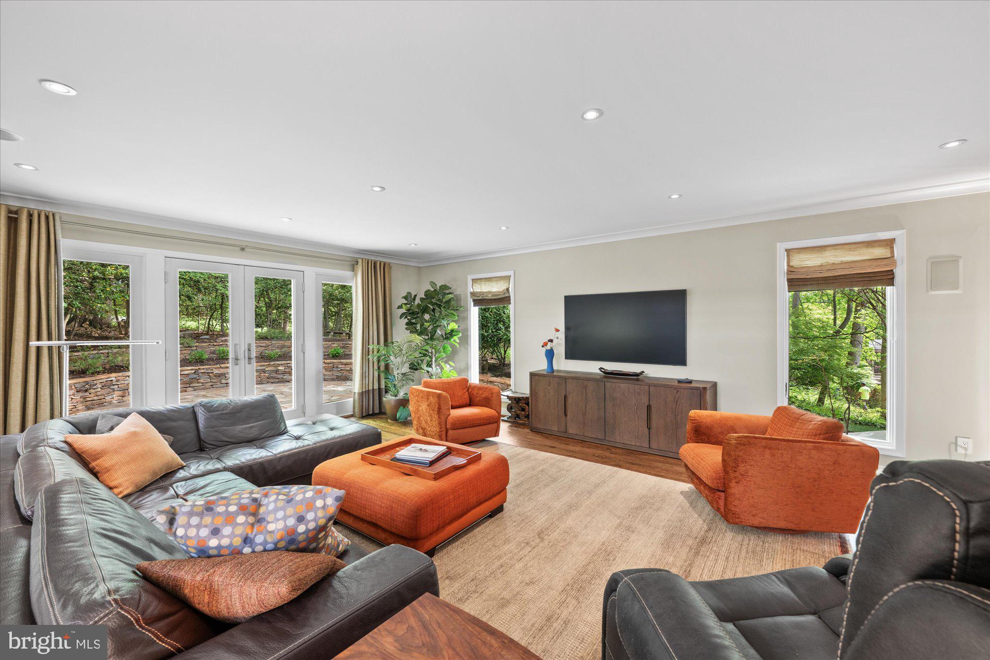 7908 Foxhound Road McLean, VA 22102 - Photo 11 of 48 a living room with furniture and a flat screen tv