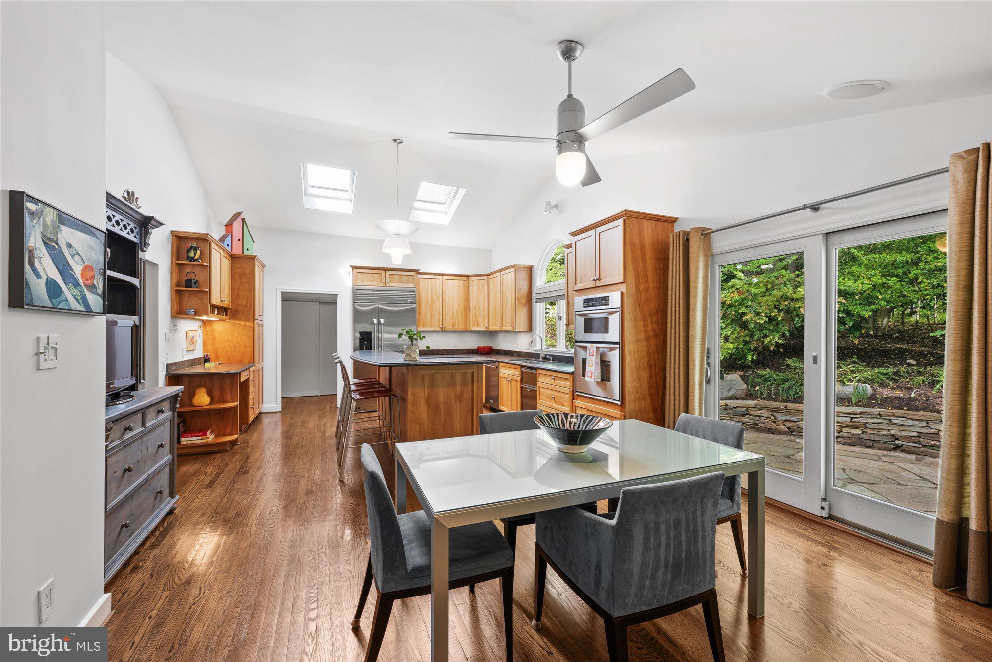 7908 Foxhound Road McLean, VA 22102 - Photo 13 of 48 a view of a dining room with furniture window and wooden floor