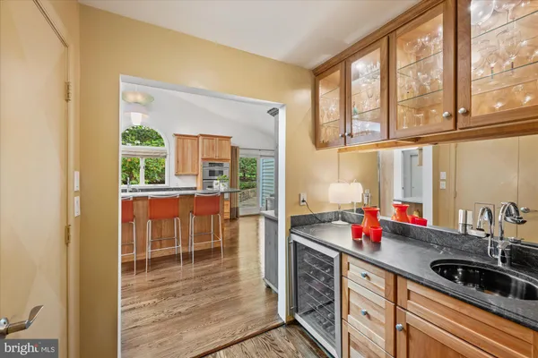 a kitchen with a sink and a large window