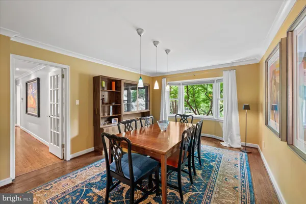 a dining room with furniture window wooden floor