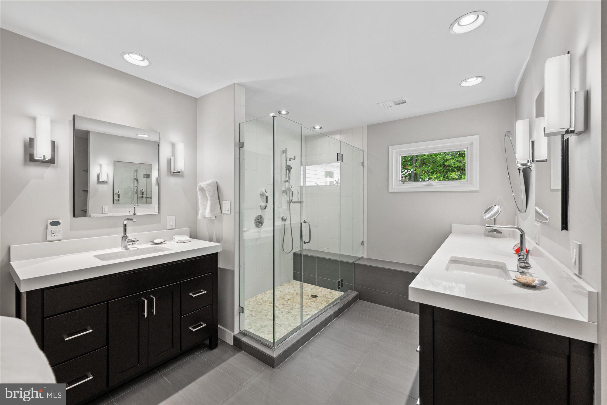 7908 Foxhound Road McLean, VA 22102 - Photo 32 of 48 a spacious bathroom with a double vanity sink mirror and double