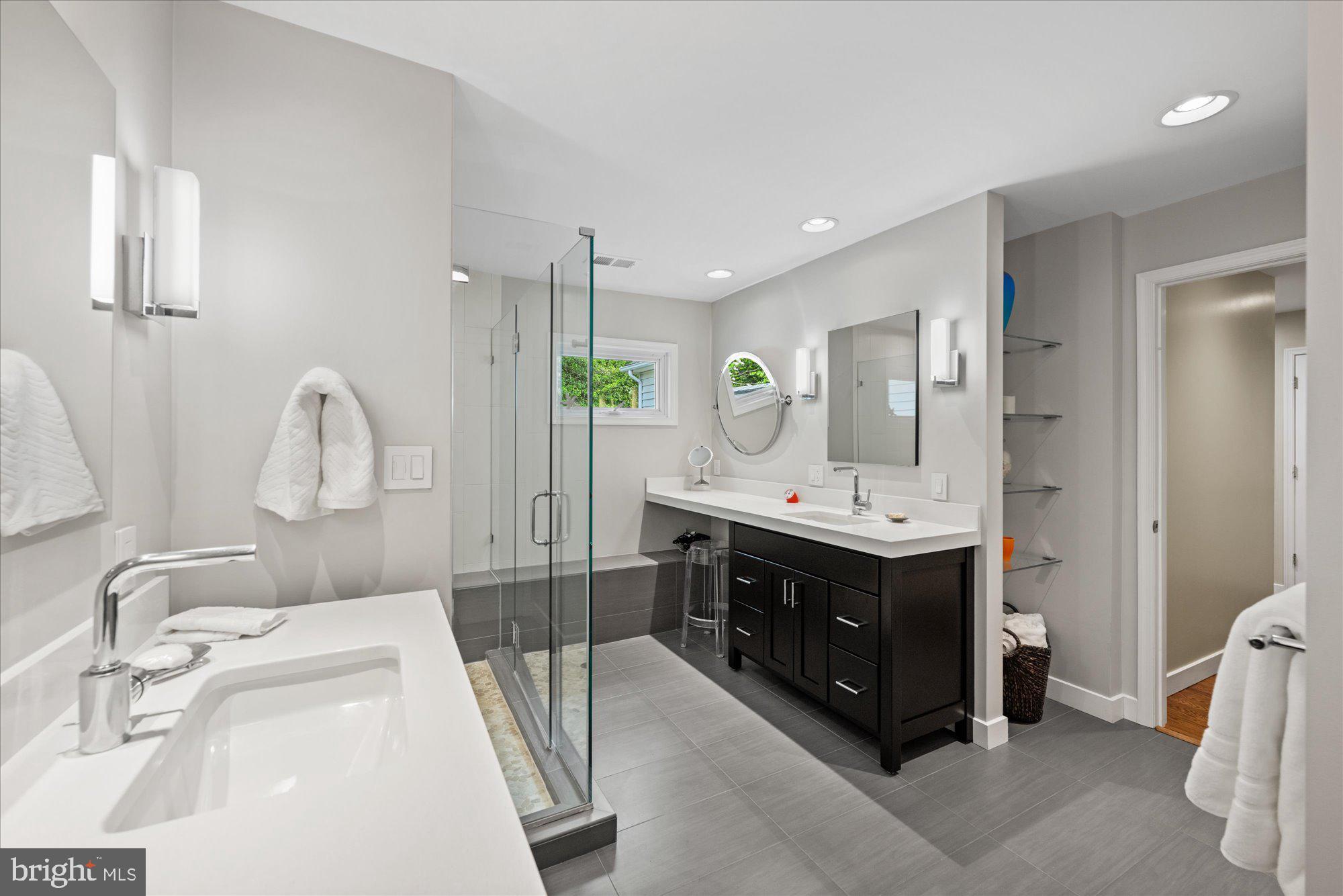 7908 Foxhound Road McLean, VA 22102 - Photo 33 of 48 a bathroom with a double vanity sink mirror and window