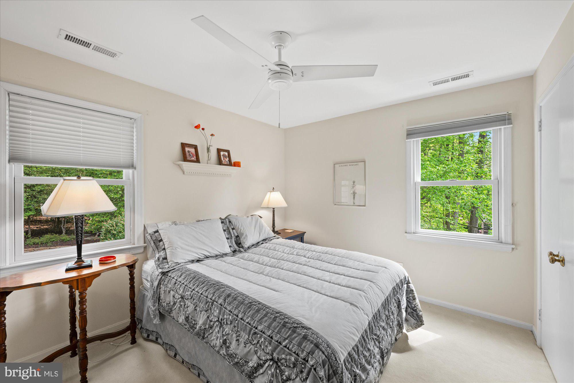7908 Foxhound Road McLean, VA 22102 - Photo 35 of 48 a bedroom with a large bed and a window