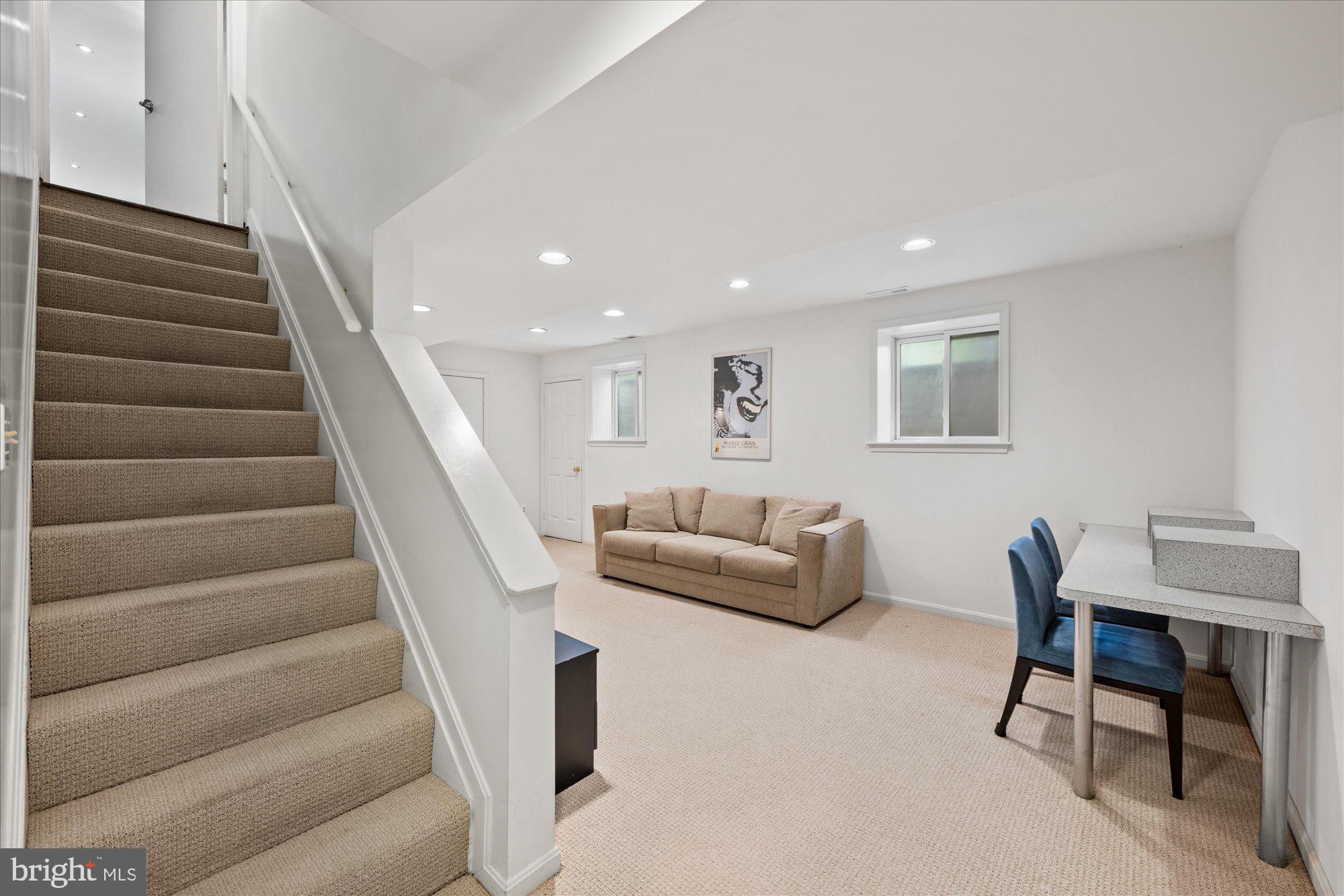 7908 Foxhound Road McLean, VA 22102 - Photo 39 of 48 a living room with furniture and a stairs