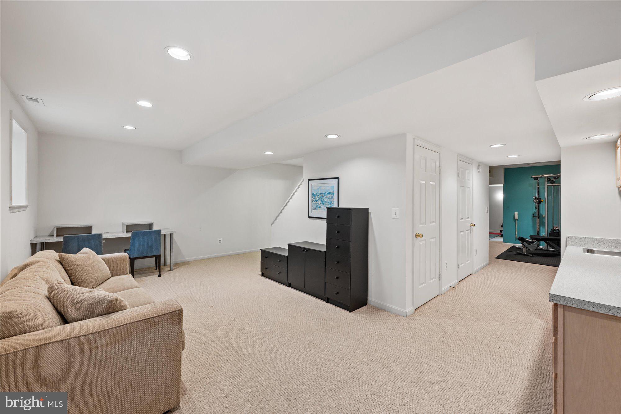 7908 Foxhound Road McLean, VA 22102 - Photo 40 of 48 a living room with furniture and kitchen
