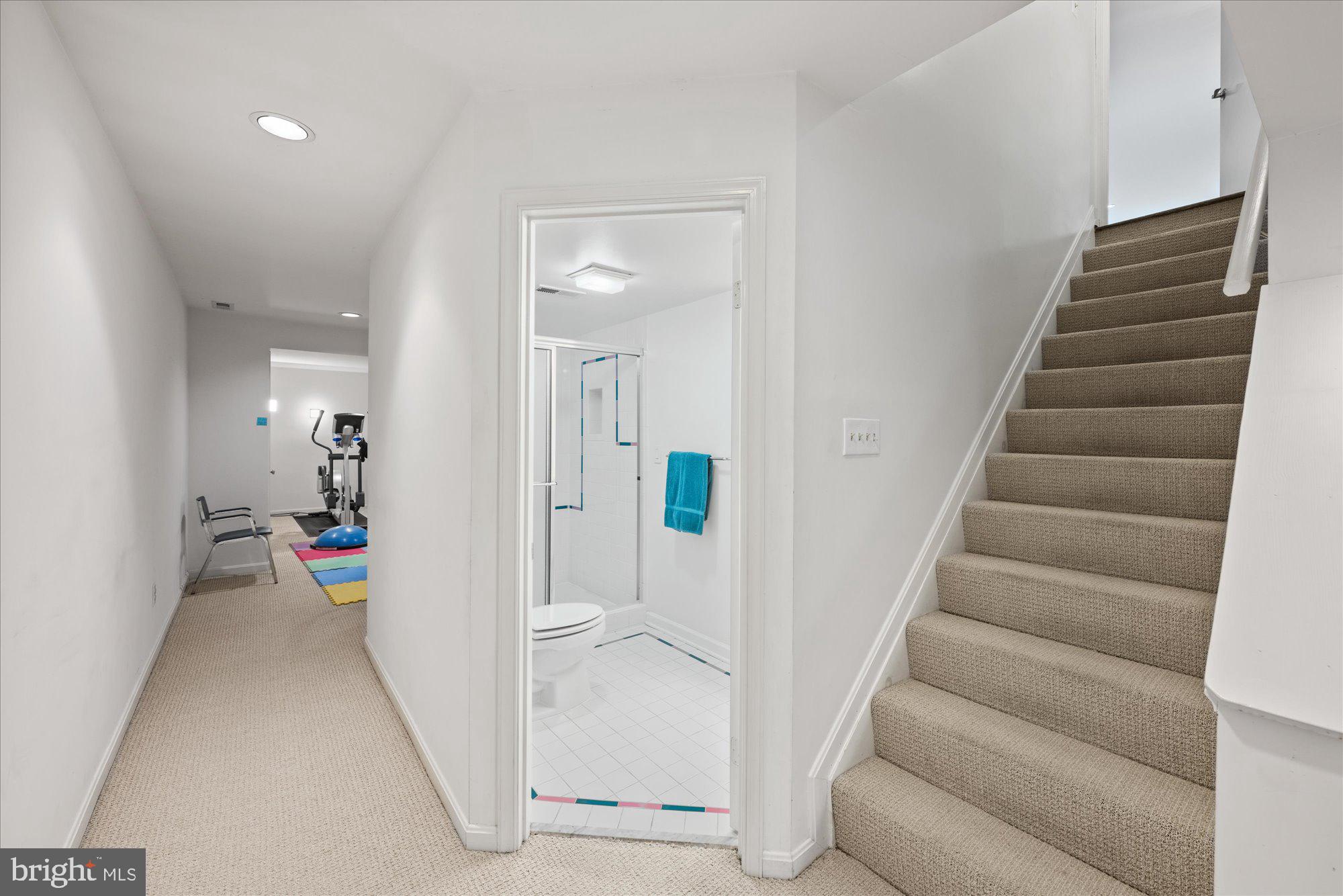 7908 Foxhound Road McLean, VA 22102 - Photo 42 of 48 a view of a hallway with wooden floor and stairs