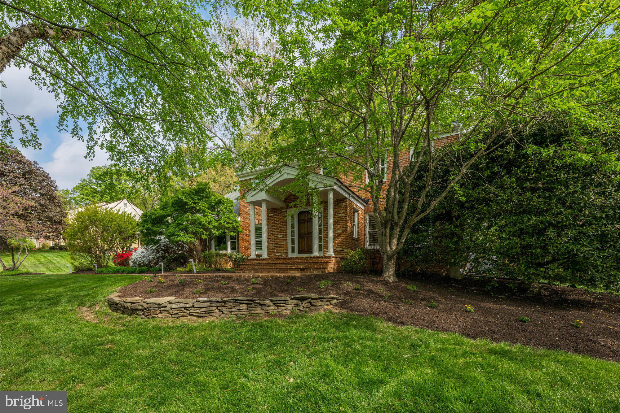 7908 Foxhound Road McLean, VA 22102 - Photo 46 of 48 a front view of a house with a yard