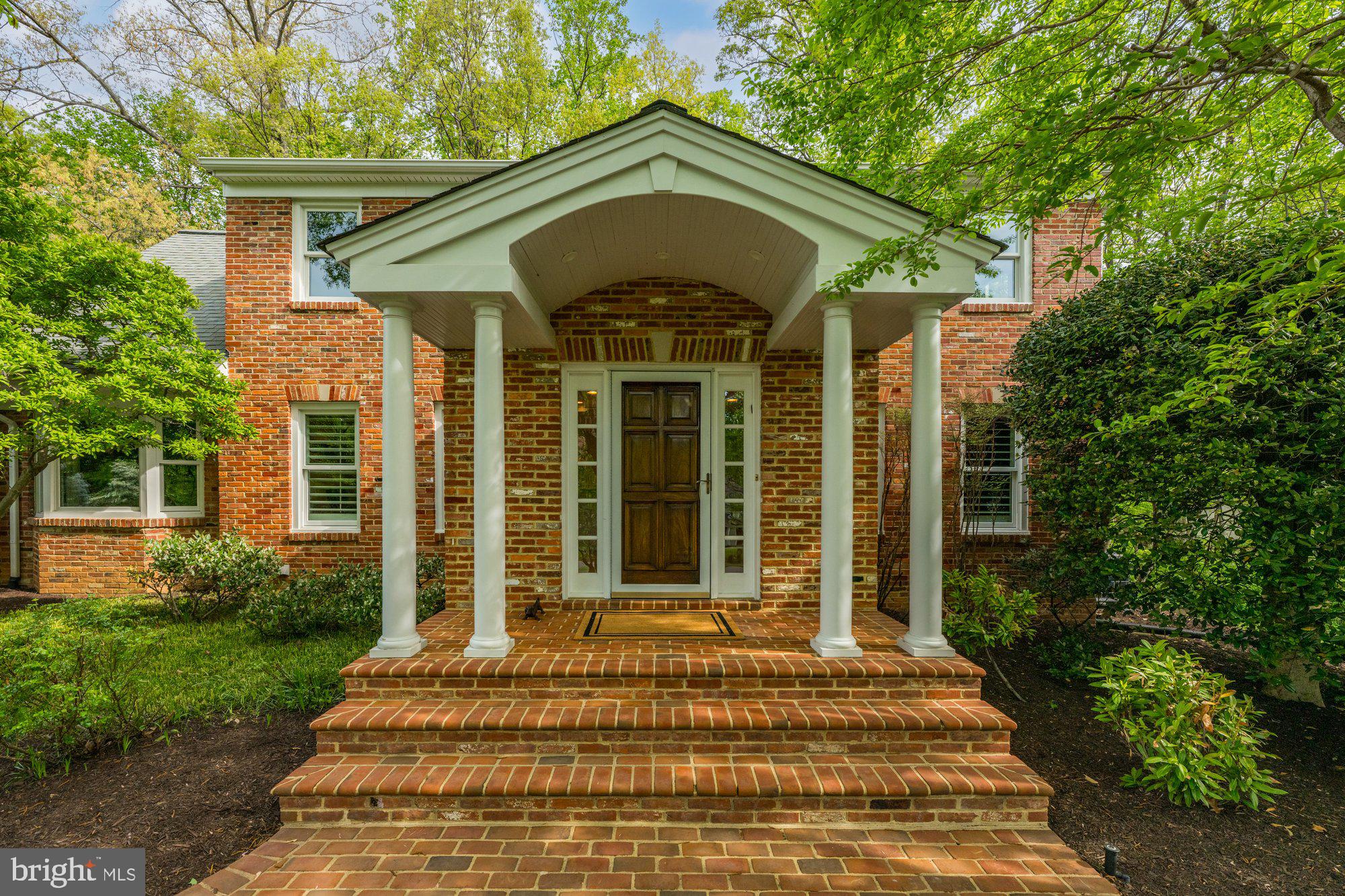 7908 Foxhound Road McLean, VA 22102 - Photo 6 of 48 a front view of a house with a porch
