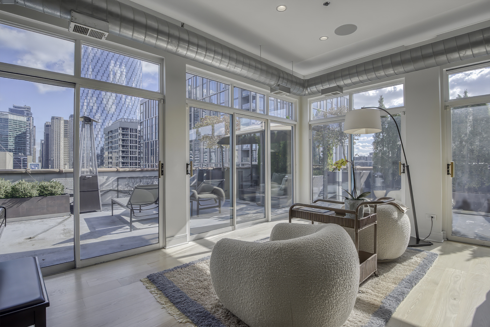 910 West Madison Street, Unit 904E Chicago, IL 60607 - Photo 16 of 56 a balcony with furniture and a large window