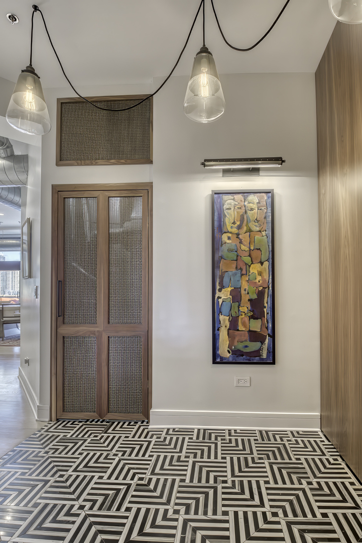 910 West Madison Street, Unit 904E Chicago, IL 60607 - Photo 2 of 56 a view of a room with wooden floor and windows