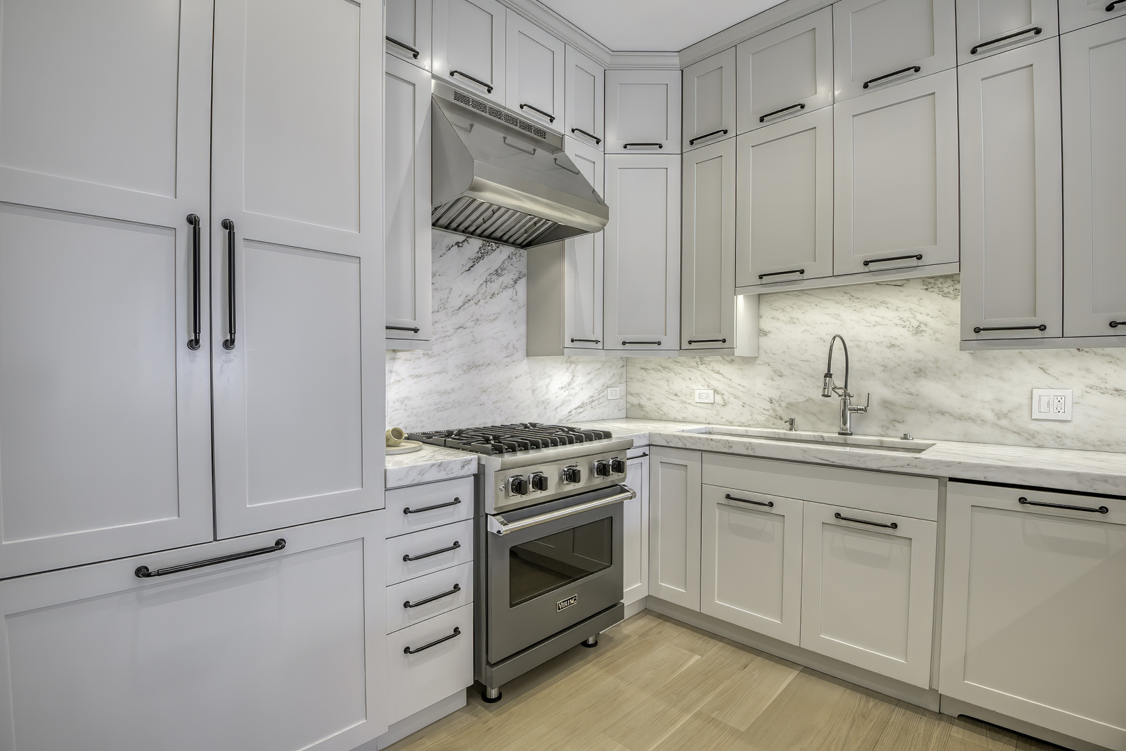910 West Madison Street, Unit 904E Chicago, IL 60607 - Photo 23 of 56 a kitchen with white cabinets and white appliances