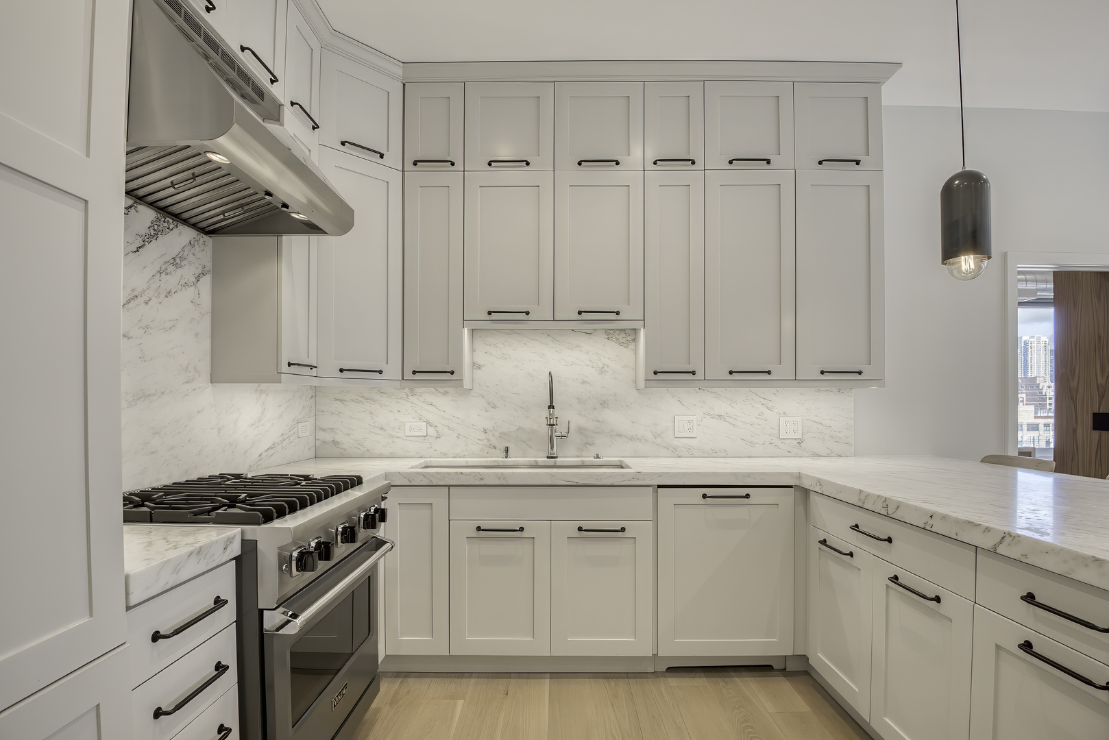 910 West Madison Street, Unit 904E Chicago, IL 60607 - Photo 24 of 56 a kitchen with stainless steel appliances granite countertop a sink a stove and cabinets