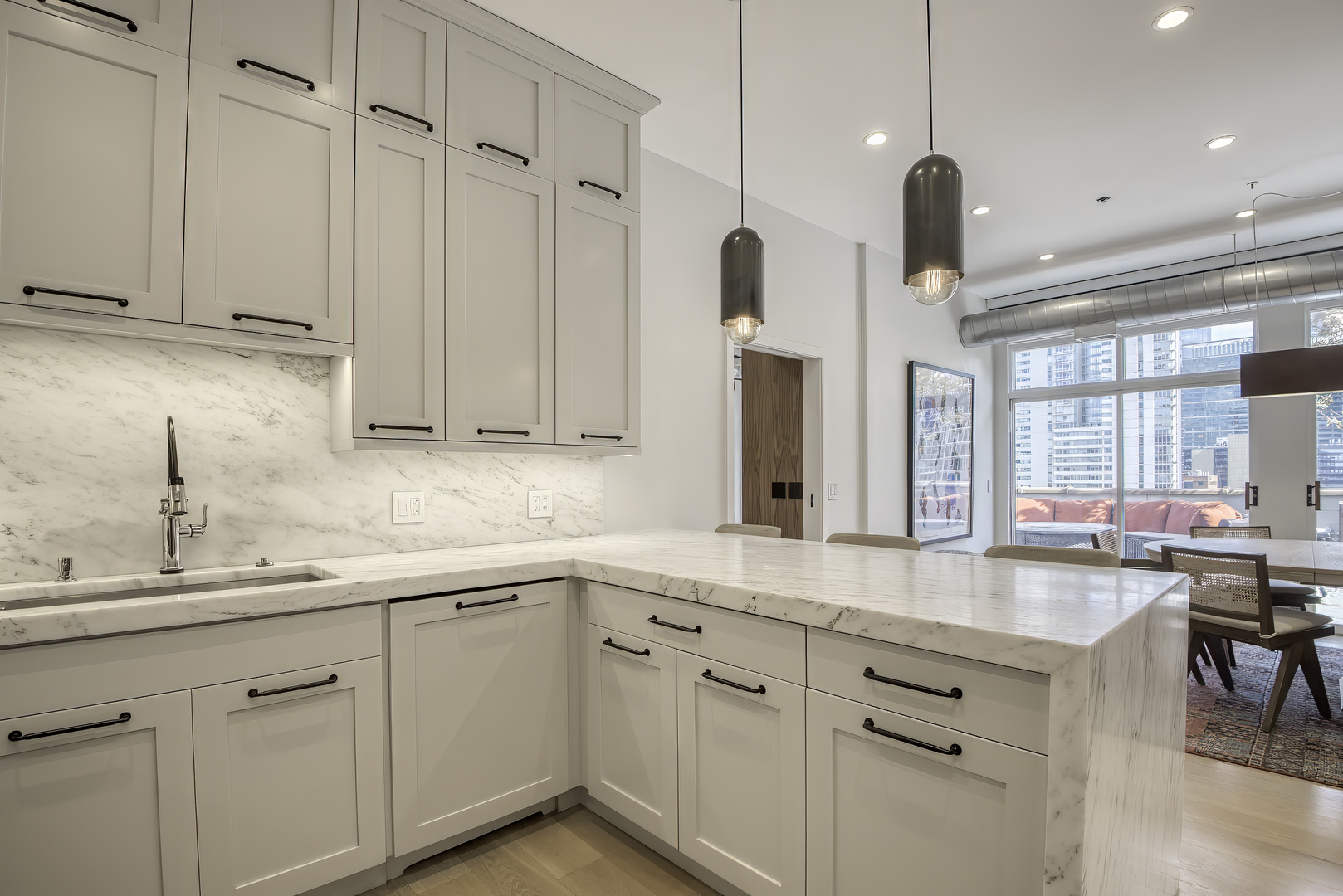 910 West Madison Street, Unit 904E Chicago, IL 60607 - Photo 25 of 56 a kitchen with white cabinets and sink