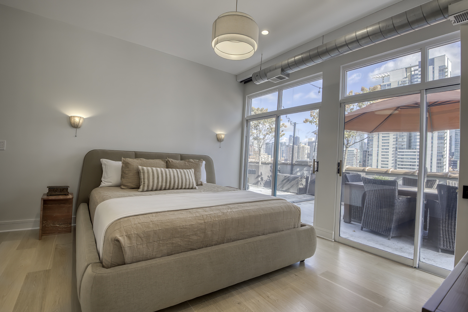 910 West Madison Street, Unit 904E Chicago, IL 60607 - Photo 28 of 56 a bedroom with a large bed and a large window