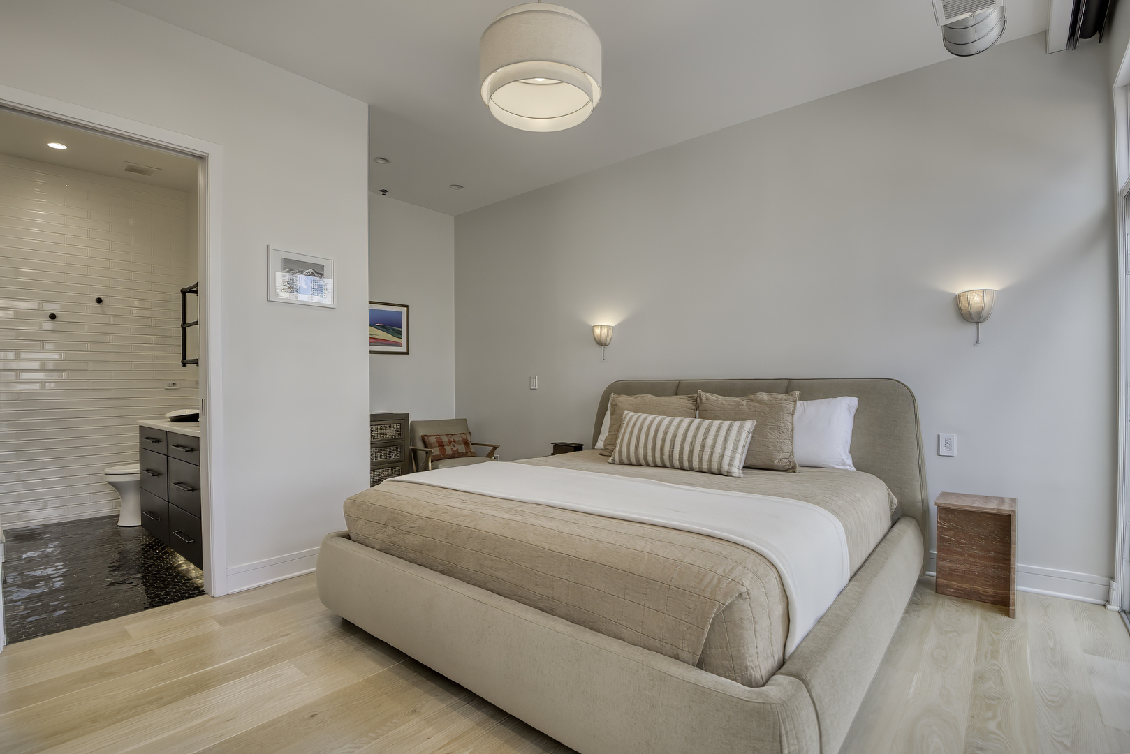 910 West Madison Street, Unit 904E Chicago, IL 60607 - Photo 29 of 56 a bedroom with a bed and a chandelier