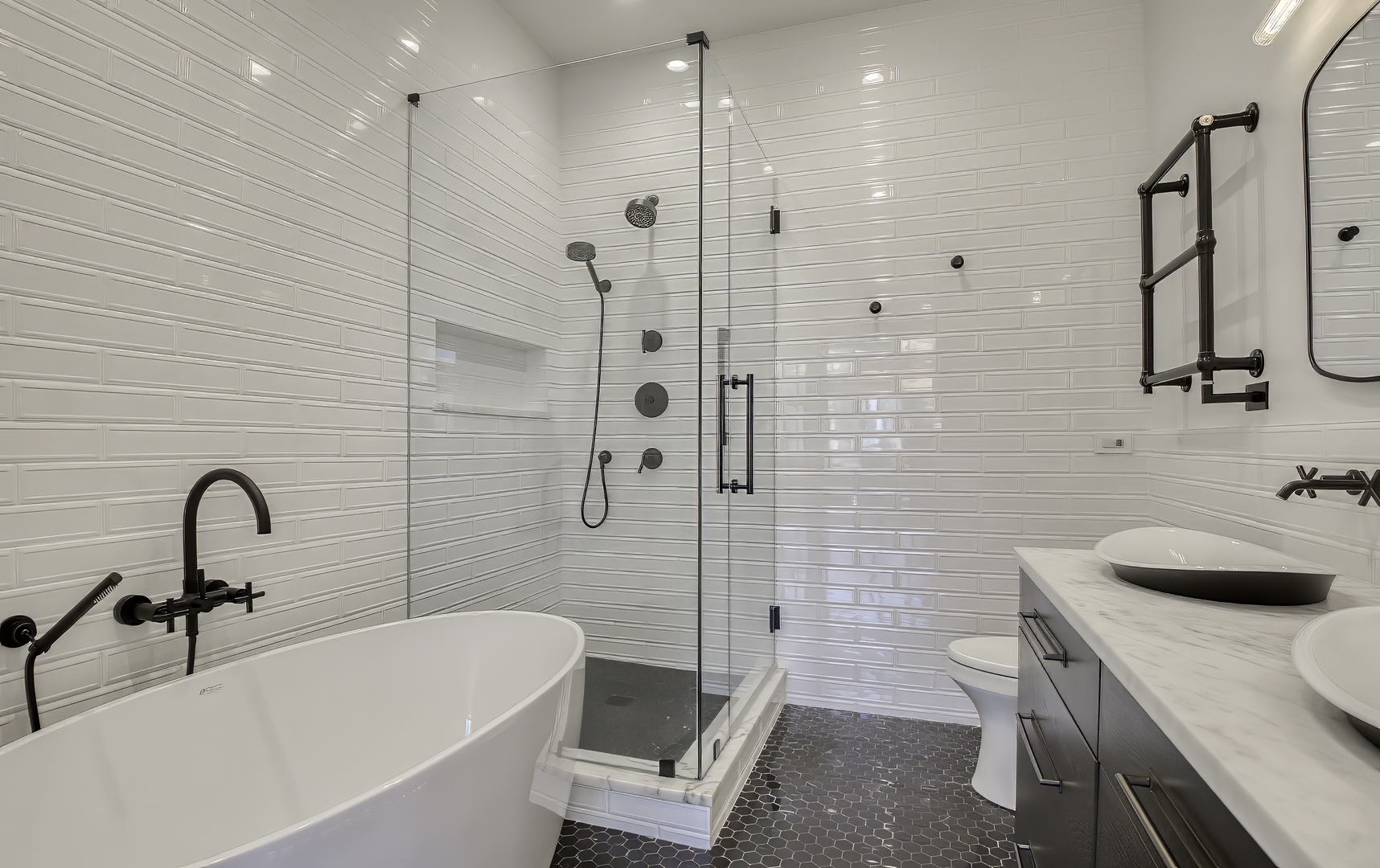 910 West Madison Street, Unit 904E Chicago, IL 60607 - Photo 31 of 56 a bathroom with a sink a toilet and shower