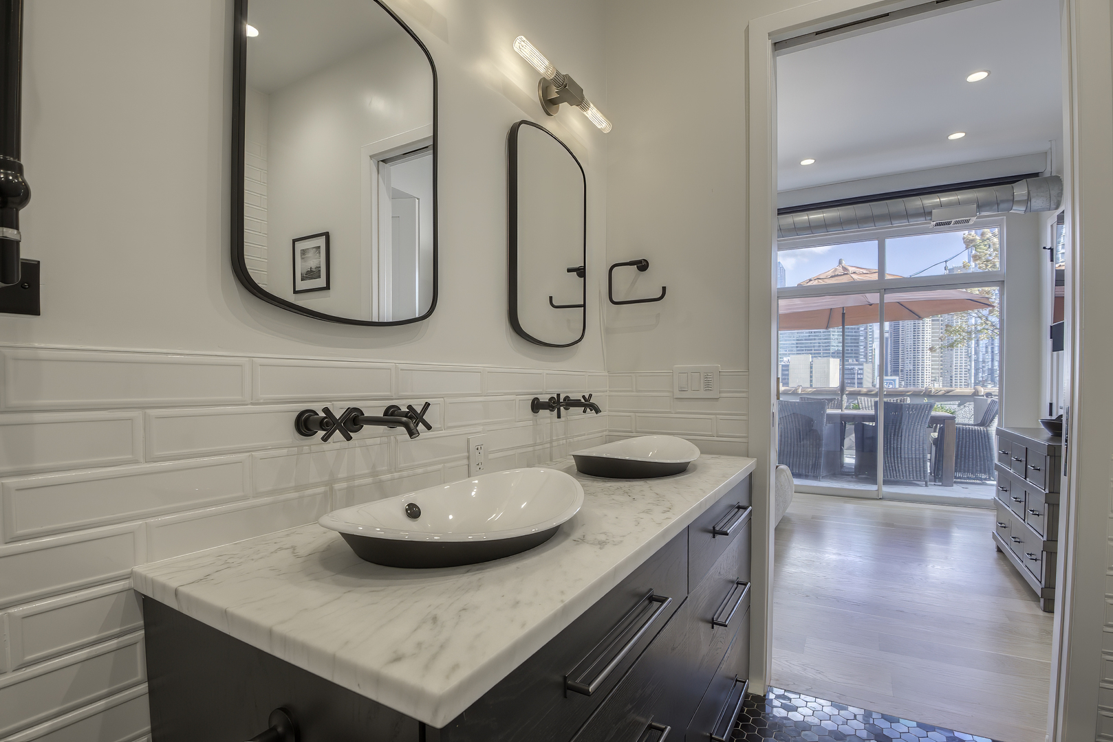 910 West Madison Street, Unit 904E Chicago, IL 60607 - Photo 34 of 56 a bathroom with a sink and a mirror