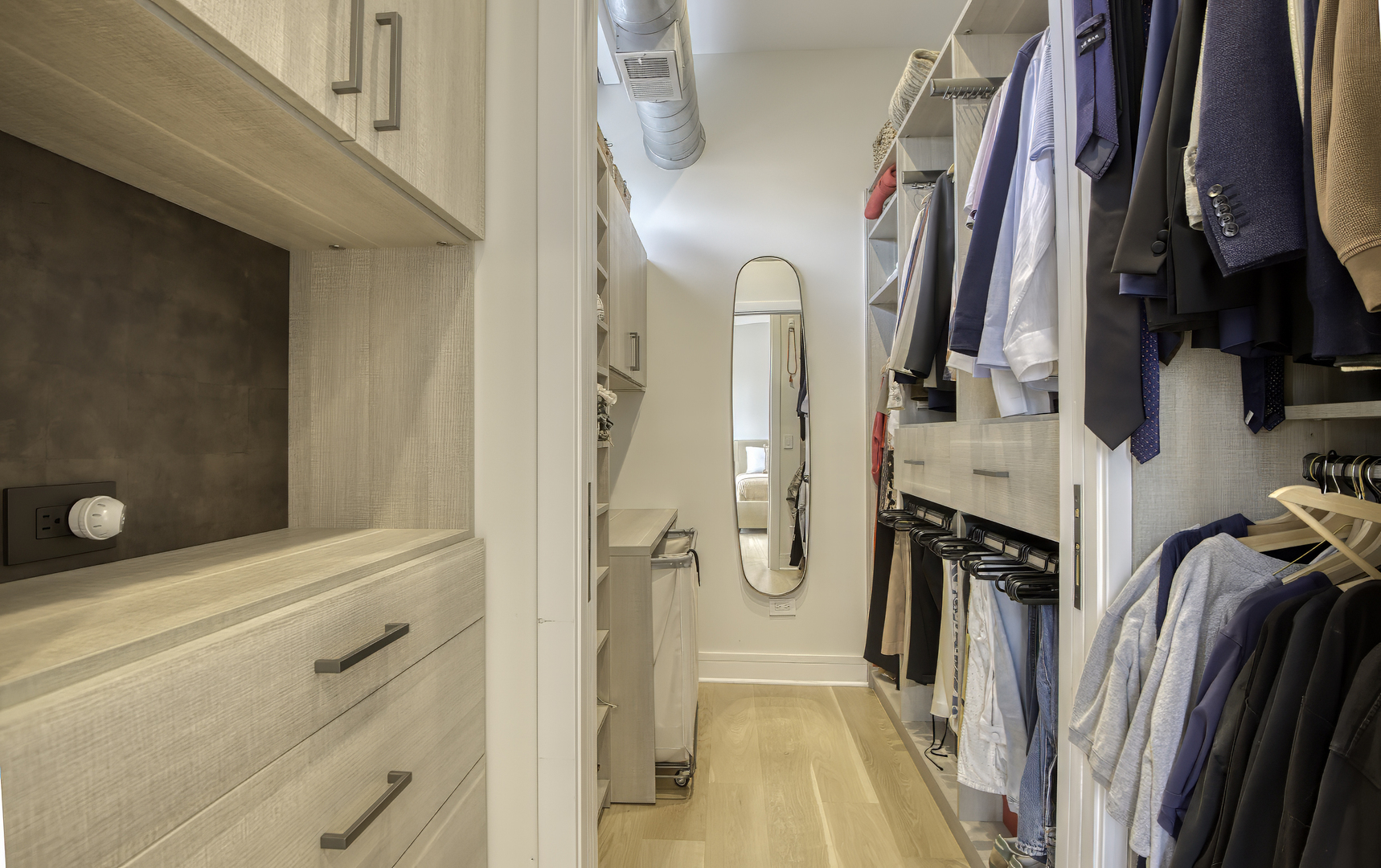910 West Madison Street, Unit 904E Chicago, IL 60607 - Photo 36 of 56 a view of walk in closet with clothes and shoes