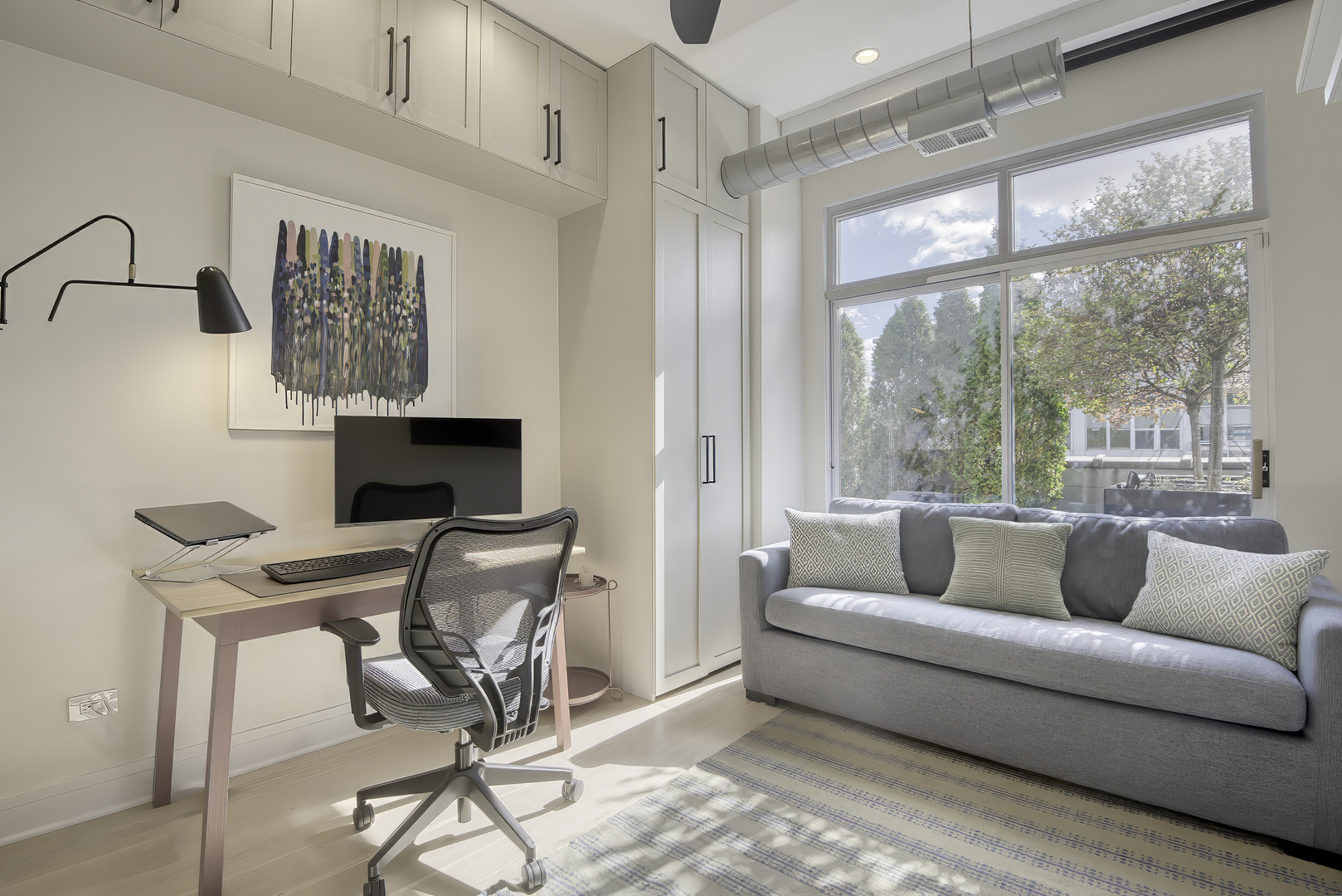 910 West Madison Street, Unit 904E Chicago, IL 60607 - Photo 45 of 56 a living room with furniture and a flat screen tv