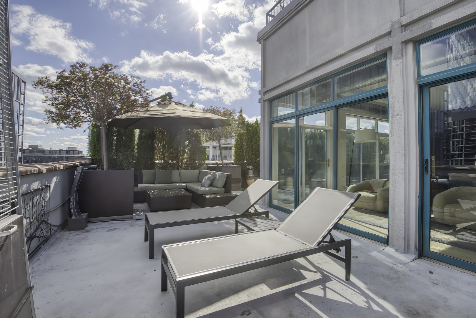 910 West Madison Street, Unit 904E Chicago, IL 60607 - Photo 47 of 56 a view of a patio with a dining table and chairs