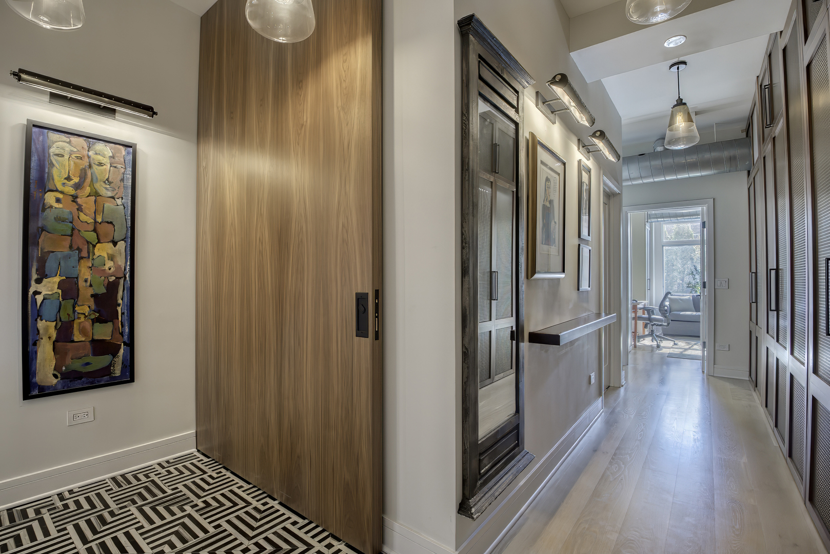910 West Madison Street, Unit 904E Chicago, IL 60607 - Photo 6 of 56 a view of a hallway with wooden floor and staircase