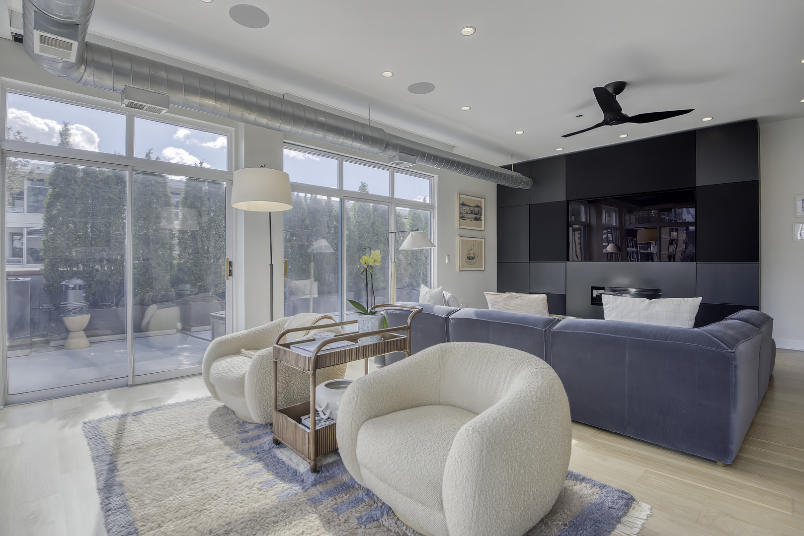 910 West Madison Street, Unit 904E Chicago, IL 60607 - Photo 9 of 56 a living room with furniture and a flat screen tv