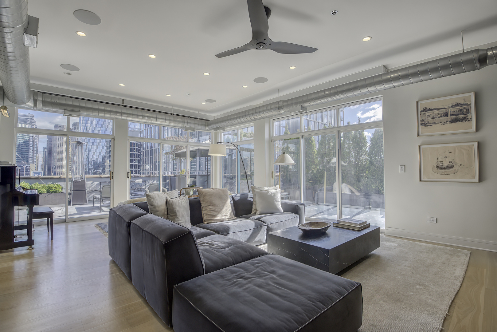 910 West Madison Street, Unit 904E Chicago, IL 60607 - Photo 10 of 56 a living room with furniture and a floor to ceiling window