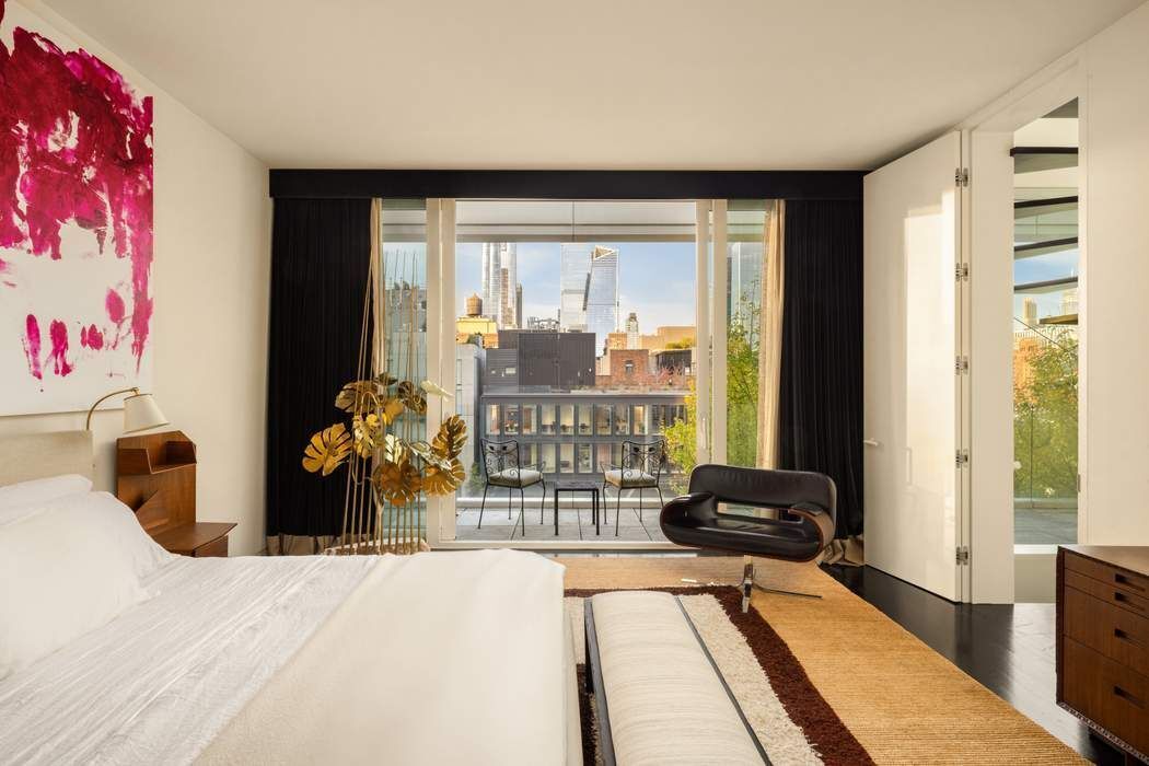 524 West 19th Street, Unit PH Manhattan, NY 10011 - Photo 11 of 27 a living room with furniture and a floor to ceiling window